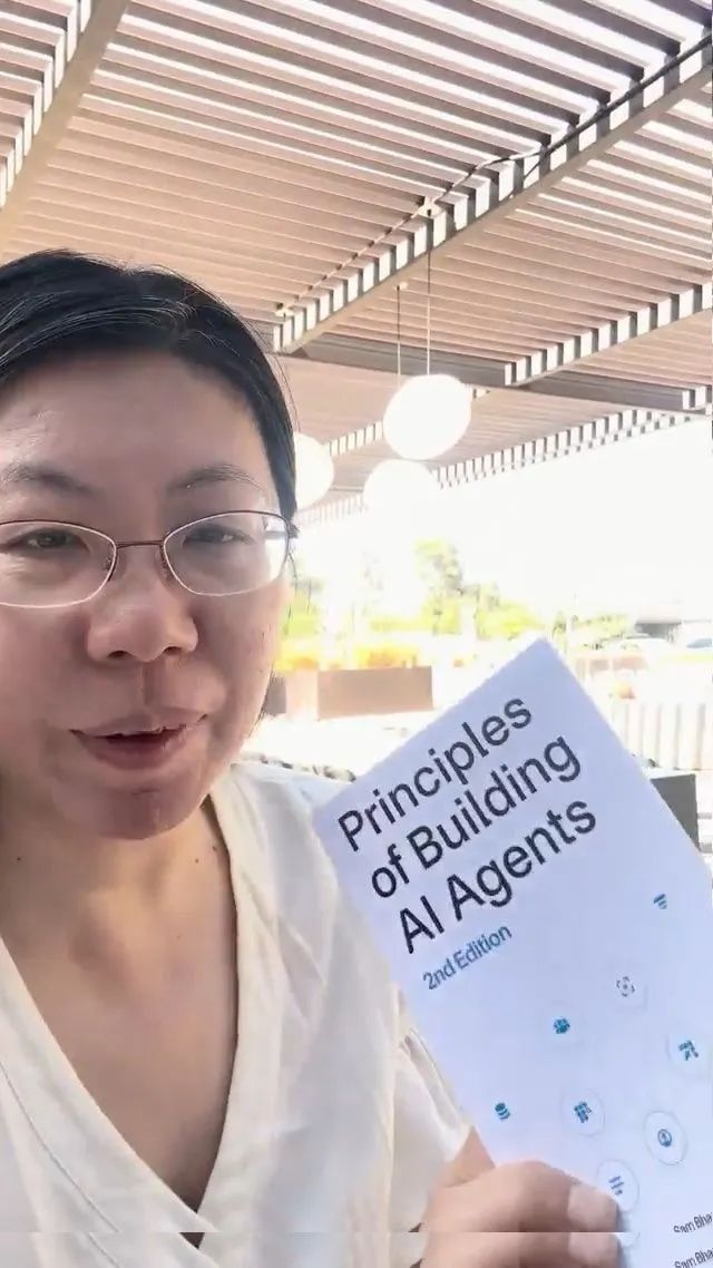 Community member with Principles of Building AI Agents outdoors